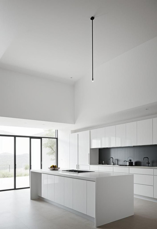 جزیره آشپزخانه بَرفانو با پوشش سفید براق و طراحی مینیمال در فضای روشن